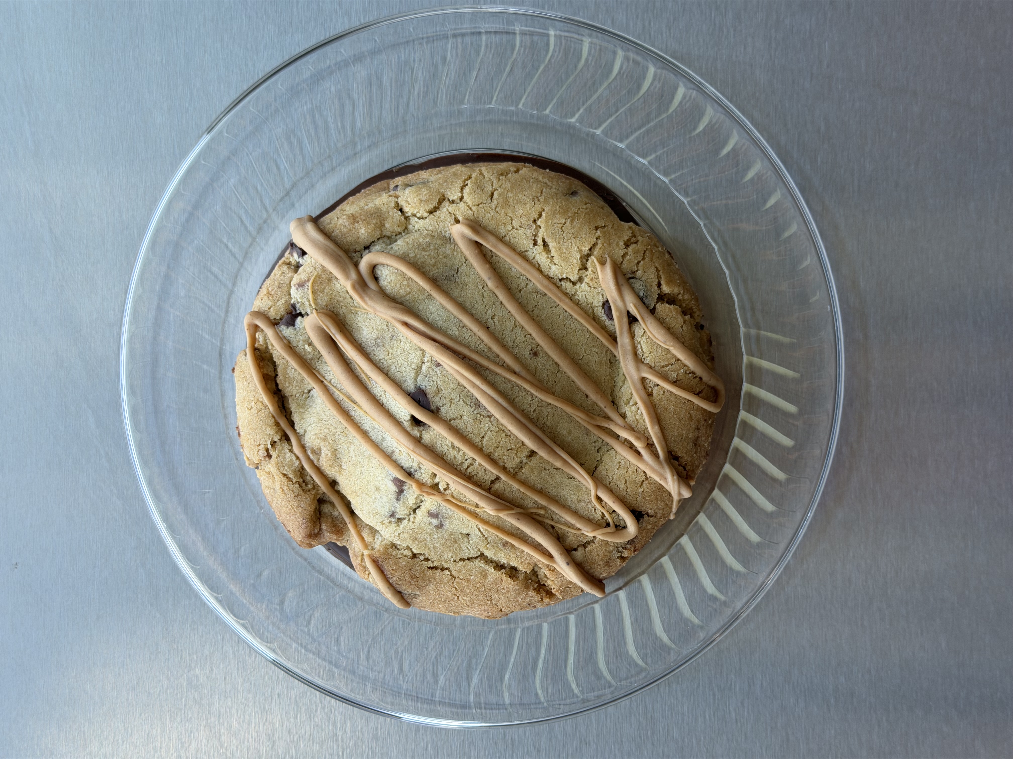 Drizzled cookie on a glass plate
